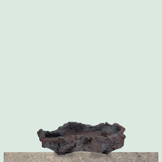 Senor Square handmade rock-style bonsai pot on a stone ledge